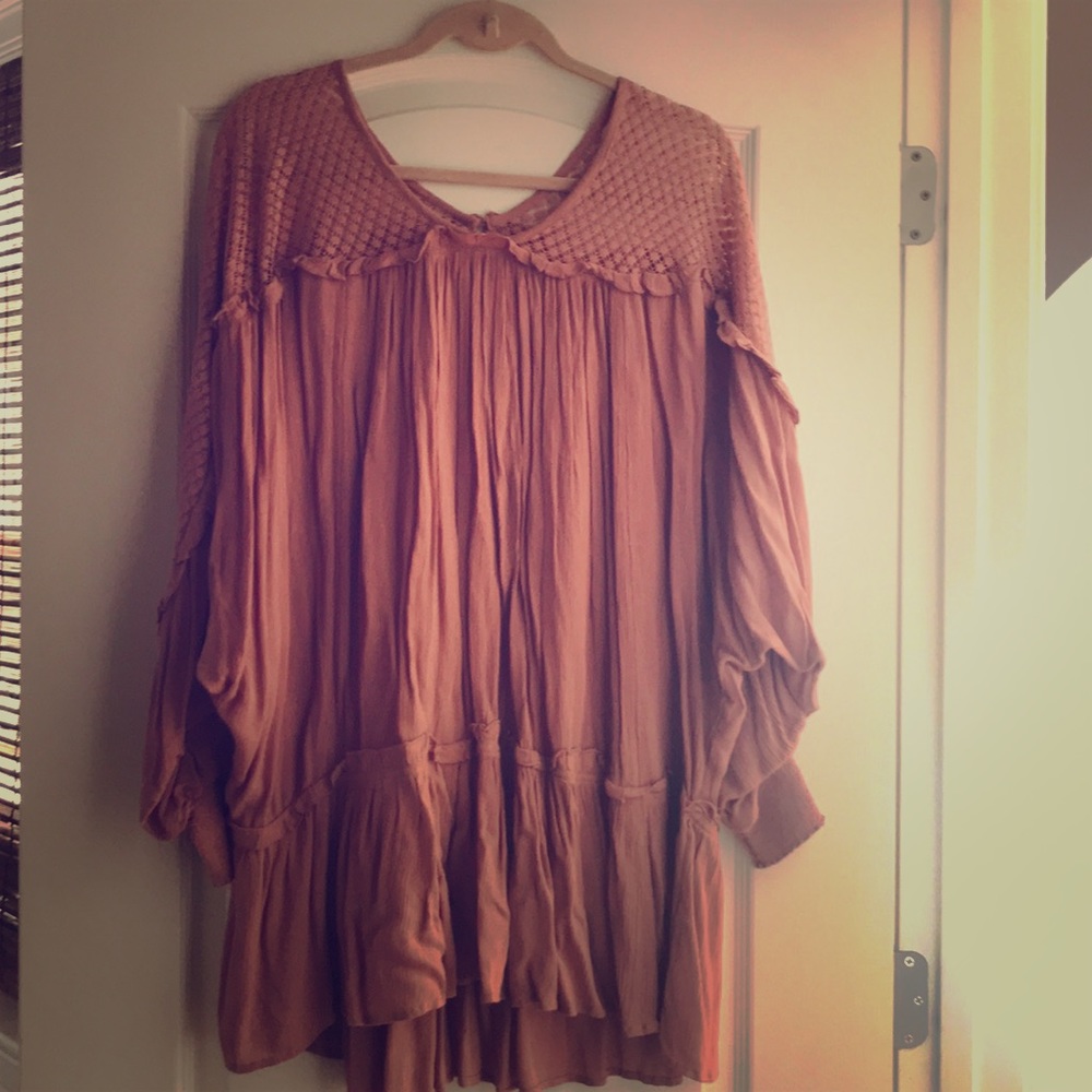 Ruffle tunic with crocheting